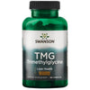A green plastic bottle with a glossy finish, cylindrical shape, and a screw-on cap. The front label uses bold white and yellow text, with “Swanson TMG Trimethylglycine dietary supplement for liver health and methylation support, containing 90 capsules” clearly visible. Serif typeface for the brand name. Plain white studio background. No people or hands present.