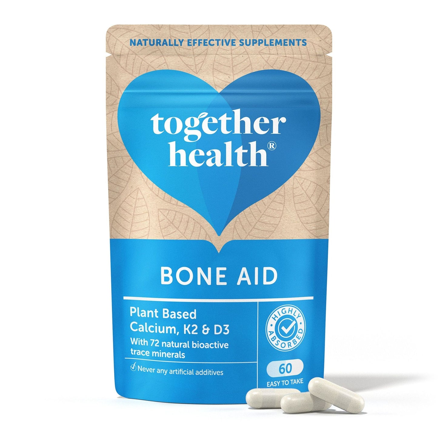 A blue and beige matte-finish pouch stands upright, with “together health BONE AID” printed in sans-serif type and additional text listing plant-based calcium, K2, D3, and 72 minerals. Three solid white capsules are placed directly in front of the pouch. The shot is on a plain background with no people or props visible.
