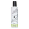 Unique Haircare Tuuheuttava Shampoo -pullo, musta korkki, kasvipiirroksia, vihreä sertifioitu luomu- ja vegaaniteksti; sylinterinmuotoinen mattapintainen muovipullo litteällä yläosalla, musta-valkoinen groteskiteksti