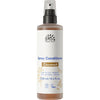 Urtekram Kookos Spray Hoitoaine (Nordic Beauty) -pullo, 250 ml, vaaleanbeige mattamuovi, hopea-valkoinen suihkusuutin; luomu- ja vegaanimerkit, selkeä groteskiteksti