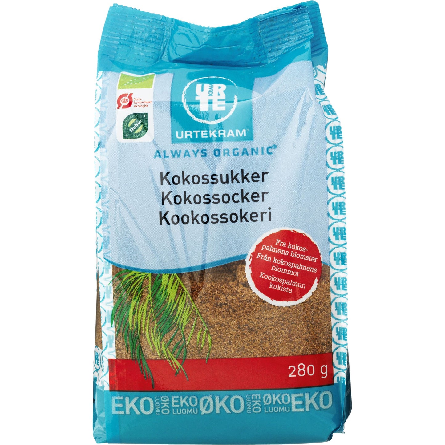 Urtekram Luomu Kookossokeri -pakkaus, 280 g, sininen-valkoinen mattapussi, teksti tanskaksi, ruotsiksi ja suomeksi; tyylitelty kookoskuvitus, useita ekomerkkejä