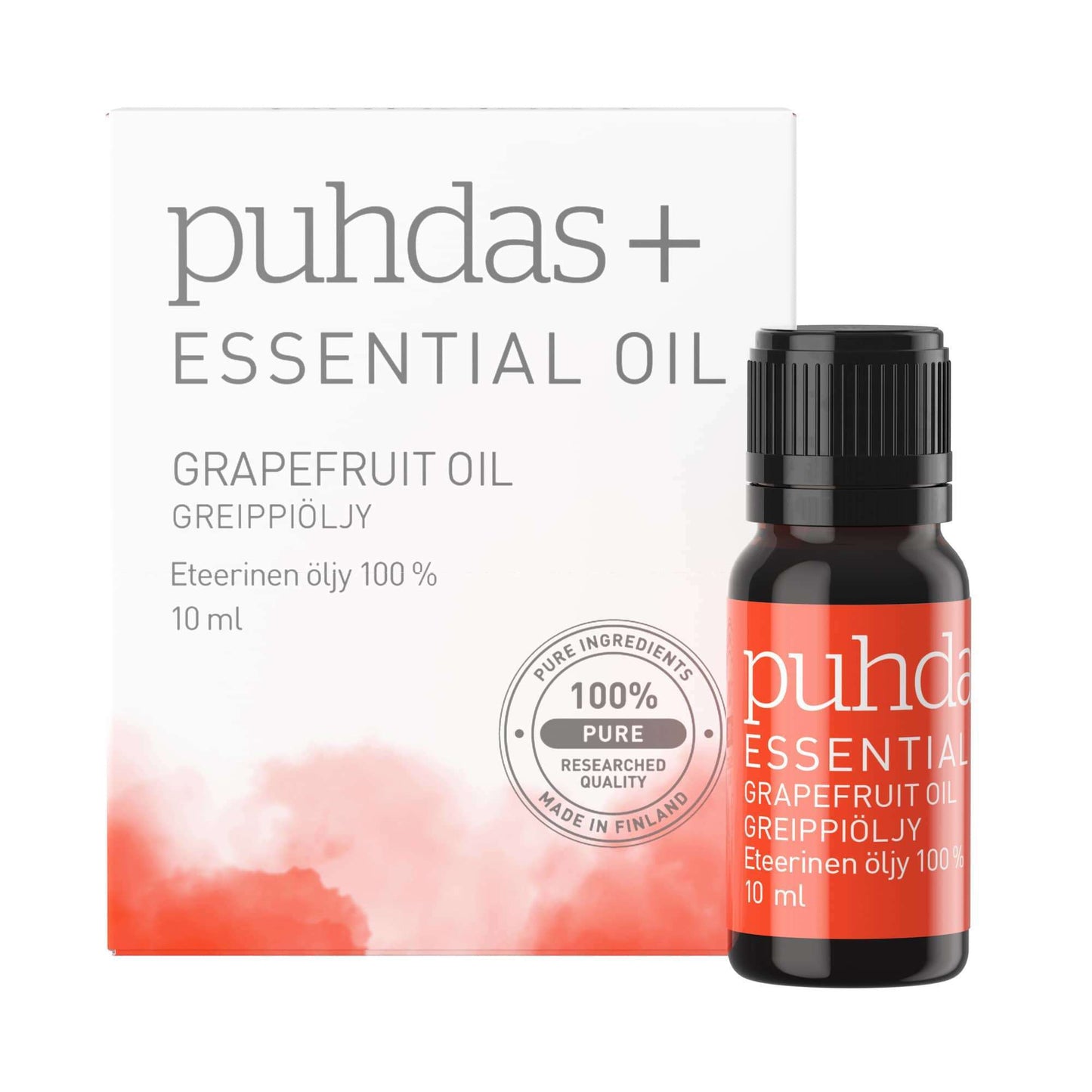 Puhdas+ Eteerinen Greippiöljy; rasia ja pullo Puhdas+ eteeristä öljyä, Greippiöljy, 10 ml, valkoisella ja punaisella etiketillä; pullossa lieriömäinen valkoinen korkki, etiketti mattapintainen yksinkertaisella groteskityypillä; rasia toistaa saman väriteeman ja keskeiset tuotetiedot, mukaan lukien "100% pure grapefruit oil" ja "made in Finland"; molemmat tuotteet esillä neutraalia taustaa vasten.