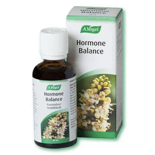 A.Vogel Hormone Balance -pullo pakkauksensa edessä, molemmissa sama etiketti sekä kuva keltaisista ja valkoisista kukista korostamassa luonnollisia ainesosia; pullo lasia, kiiltäväpintainen, lieriömäinen, valkoinen kierrekorkki; sekä rasiassa että pullossa lihavoitu vihreä brändinimi ja musta groteskiteksti tuotenimelle; pakkaus pystyssä vaalealla taustalla; ei ihmisiä tai toimintaa; kuvattu suoraan edestä silmän tasolta.