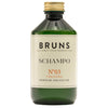 BRUNS Products Nº03 Hajusteeton Shampoo; vihreä muovipullo kultaisella, mattapintaisella kierrekorkilla; etiketissä mustaa ja kultaista groteskitypografiaa tekstillä "BRUNS SCHAMPO N°03 UNSCENTED MOISTURE AND VOLUME" sekä iskulause "ALWAYS GREAT HAIRDAYS"; pullo lieriömäinen suorin sivuin; tausta valkoinen, ei ihmisiä tai käsiä kuvassa.