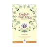English Tea Shop Organic Pure Me -tee, kofeiiniton piparminttusekoitus yrteillä ja mausteilla; suorakulmainen, mattapintainen pahvipakkaus, kukkakuvioin koristeltu, pääväri turkoosi monivärisin kukkakuvituksin; luettavissa maininta 20 teepussista ja painosta 30 g (1,06 oz); ei ihmisiä tai käsiä; tuote kuvattu vaalealla taustalla.