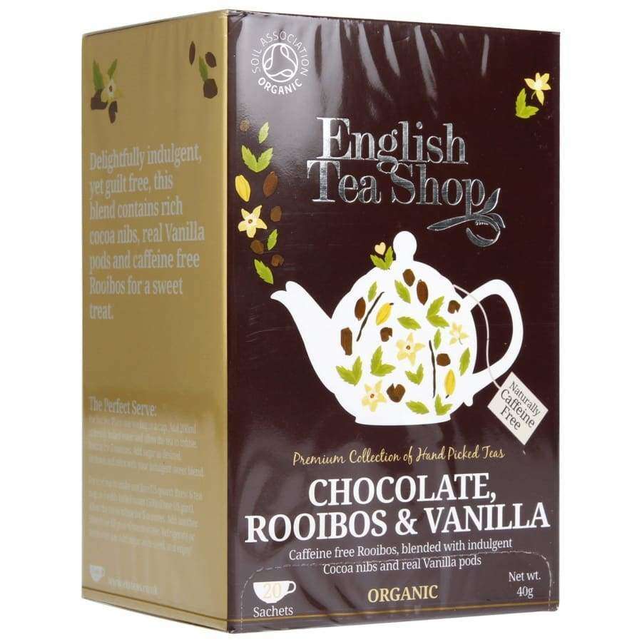 English Tea Shop Luomu Suklaa-Rooibos-Vanilja Tee -pakkaus, ruskea-kerma, tyylitelty teekannukuvitus lehtineen ja kaakaopalkoineen; antiikva- ja groteskiteksti, 40 g