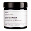 Evolve Radiant Glow Kasvonaamio -purkki, 60 ml; musta, sylinterimäinen ja kiiltäväpintainen purkki; valkoisessa suorakulmaisessa etiketissä tekstausvapaata tekstiä tuotteen soveltuvuudesta kaikille ihotyypeille sekä raakakaakaosta, kookoksesta ja 100-prosenttisesta luonnollisuudesta; kuvattu studiotaustaa vasten, ei ihmisiä tai käsiä näkyvissä.
