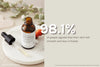 Evolve Rosehip Miracle Oil Tuhkimo Kasvoöljy -pullo mustalla kumipäisellä lasitippurilla, meripihkanvärinen runko, aseteltuna sileälle, mattapintaiselle beigelle alustalle; valkoisessa etiketissä mustaa tekstausvapaata tekstiä; kuvan päällä suorakulmainen tekstiruutu "98.1% of people agreed that their skin felt smooth and less irritated"; ei ihmisiä tai käsiä näkyvissä.