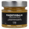 Fiini Naturally Puhdistusbalmi Hellävarainen Kaura, 156 ml; lasipurkki mustalla etiketillä, teksti valkoisella ja beigellä suomeksi, ruotsiksi ja englanniksi; sisällä kultaisenkeltainen hoitava balmi; purkki leveä ja sylinterinmuotoinen, mattapintainen, suorat reunat ja tasainen pohja; kansi metallinen ja mattapintainen; neutraali tausta ilman ihmisiä tai käsiä.
