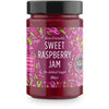Good Good Keto Vadelmahillo; lasipurkki vadelmahilloa, kiiltäväpintainen ja lieriömäinen, metallinen kansi; etiketti violetti ja vihreä, luettavissa "Keto Friendly", "Sweet Raspberry Jam", "No Added Sugar", hedelmäkuvituksin; kirjasintyyli selkeä ja groteski; tuotteen paino 330 grammaa; tausta ja ympäristö eivät näy kuvassa.