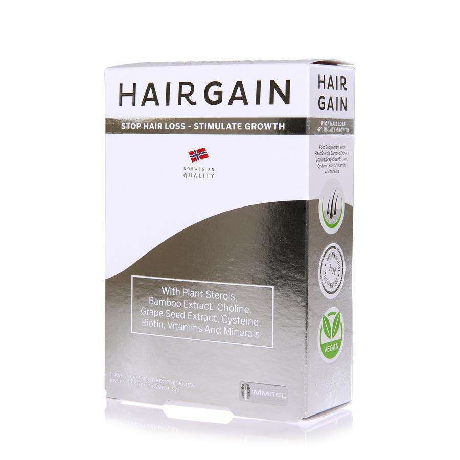 Hairgain-pakkaus; suorakulmainen, mattapintainen rasia pääosin valkoisena vihrein ja mustin korostuksin; teksti "Stop Hair Loss – Stimulate Growth"; etiketti mainitsee kasvisterolit, bambu-uutteen, vegaanisuuden ja norjalaisen laadun; lihavoitua tekstausvapaata tekstiä; kuvattu valkoista taustaa vasten, ei ihmisiä tai käsiä näkyvissä.