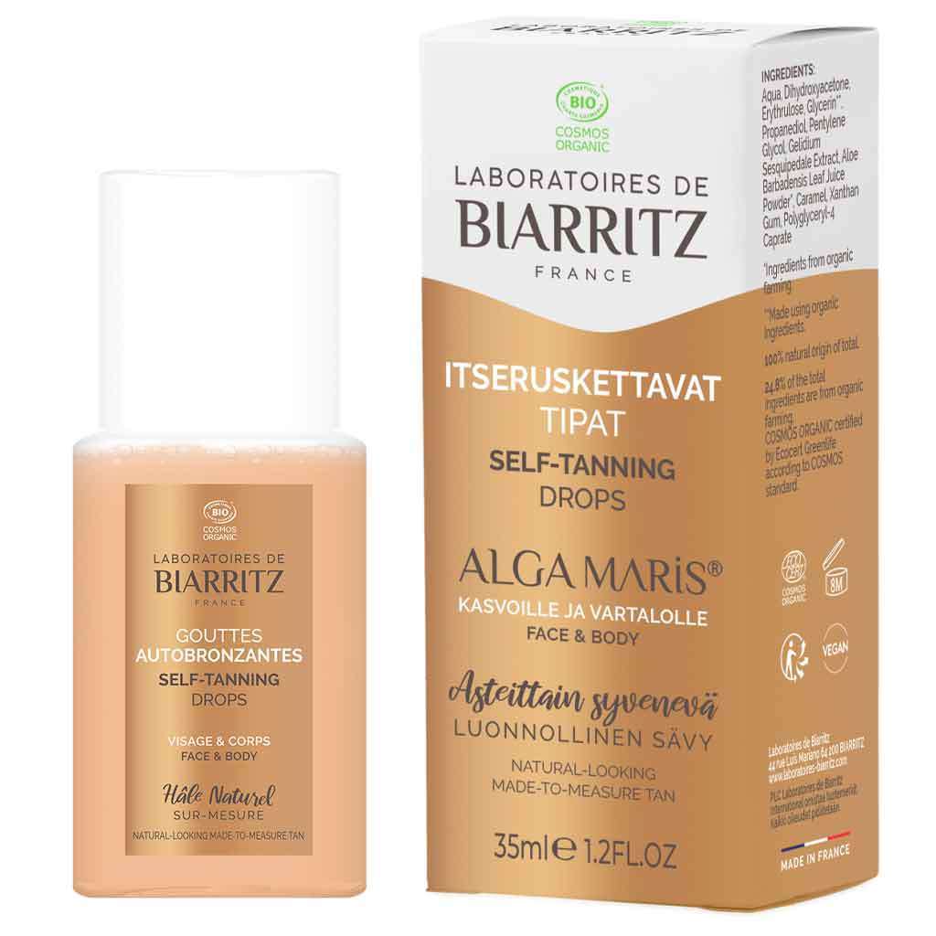 Laboratoires de Biarritz Alga Maris Itseruskettavat kasvotipat; pullo ja pakkaus Laboratoires de Biarritz Alga Maris -itseruskettavia tippoja kasvoille ja vartalolle, beige pullo valkoisella muovikorkilla ja mattapinnalla, monikielinen teksti groteskikirjasimella, aseteltuna valkoisen ja beigen suorakulmaisen laatikon viereen yhteensopivalla typografialla; tausta pelkistetty valkoinen, ei ihmisiä tai käsiä kuvassa.