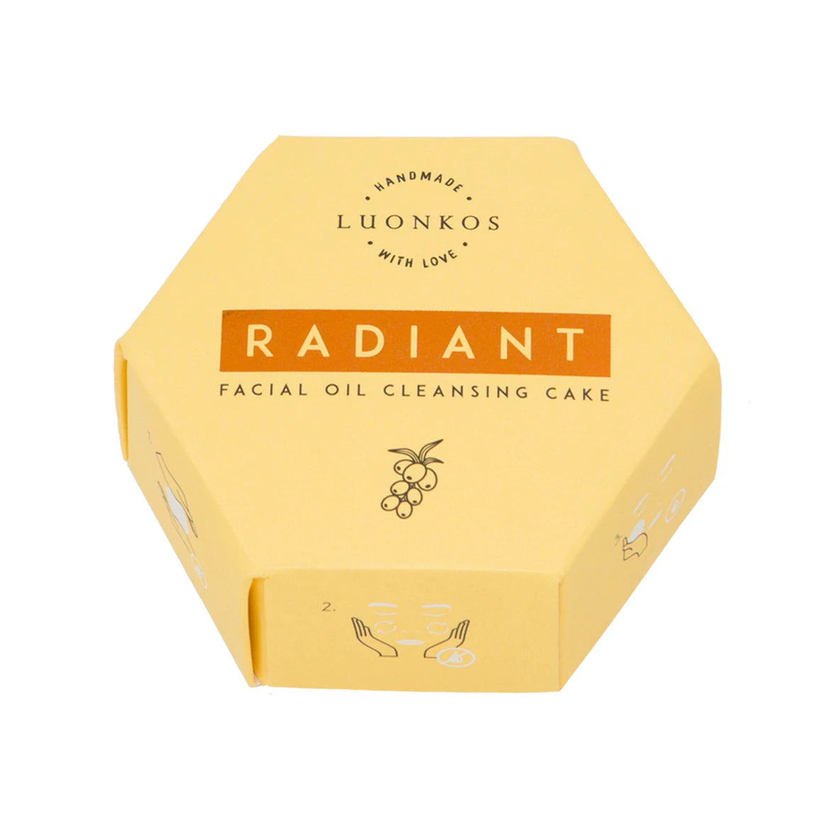 Luonkos Radiant Facial Oil Cleansing Cake -pakkaus, keltainen kuusikulmainen laatikko, kuvitus marjoista ja korostettu ravitseva ihonhoitovaikutus; pakkaus mattapintainen, mustaa tekstausvapaata typografiaa etupaneelissa; pieni värikäs marjakuvio tekstin lähellä; tuote valkoista taustaa vasten, ei ihmisiä tai käsiä näkyvissä; kuva otettu suoraan ylhäältä.