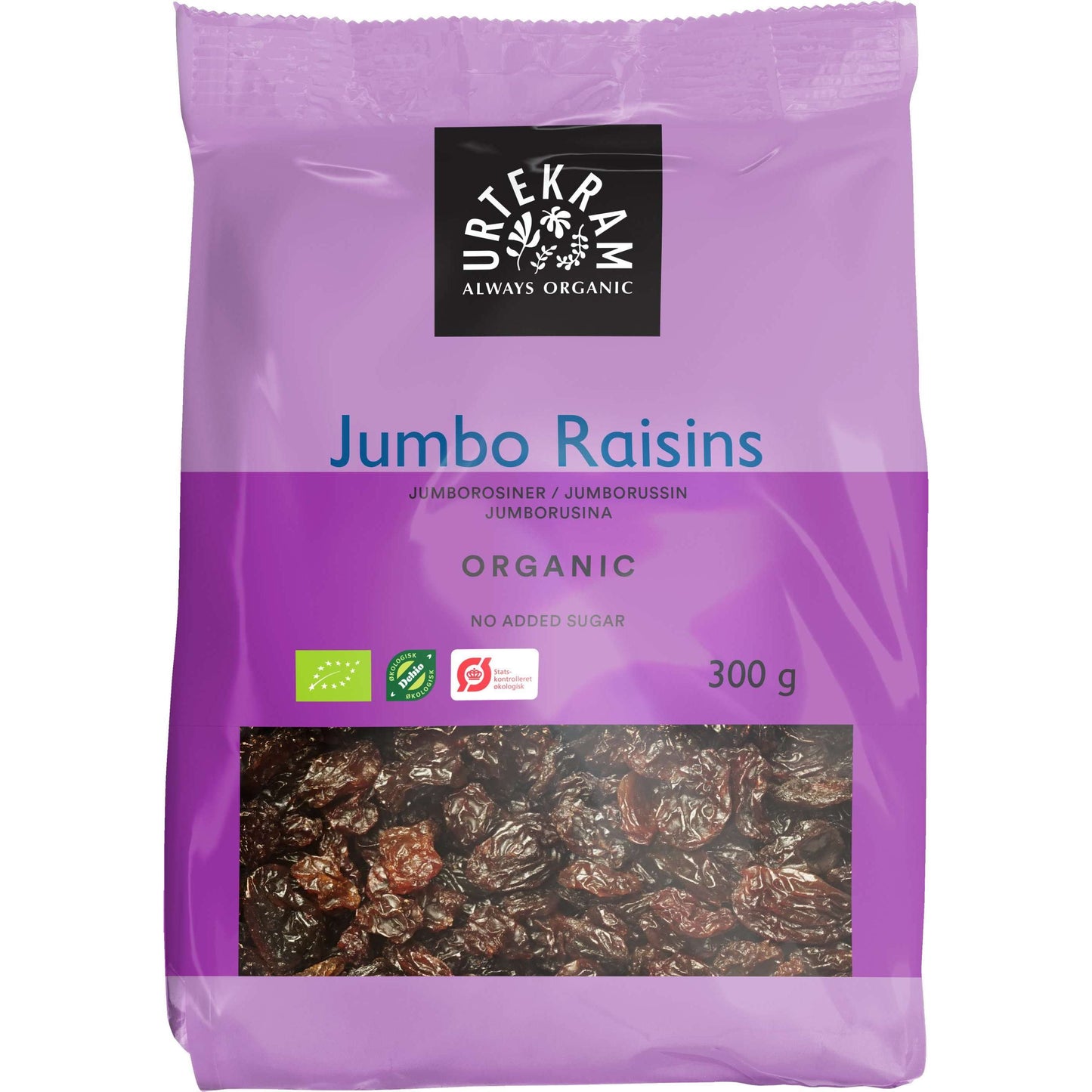 Urtekram Luomu Jumborusina, 300 g; violetti, mattapintainen muovipakkaus, jossa lukee ei lisättyä sokeria; suorakulmainen muoto; valkoista ja mustaa tekstausvapaata tekstiä sekä luomusertifiointilogoja yläreunassa; pakkauksen alaosa läpinäkyvä, jonka läpi näkyy tummia rusinoita; ei ihmisiä tai taustaa näkyvissä, tuote kuvattu yksin keskellä.