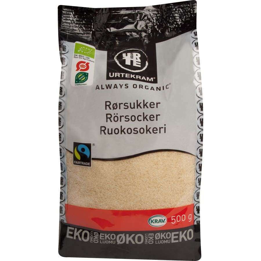 Urtekram Luomu Ruokosokeri -pussi, 500 g, Fairtrade- ja KRAV-merkit; suorakulmainen mattapintainen pakkaus, harmaa-punainen väritys, musta-valkoinen groteskiteksti useilla kielillä