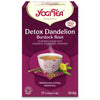 YogiTea Luomu Detox Dandelion Burdock Root -pakkaus, violetti, valkoinen höyryävä teekuppi ja kanelitankoja kuvituksessa; teksti valkoisena ja kultaisena, kofeiiniton, luomu, 17 teepussia