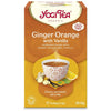 YogiTea Luomu Inkivääri-Appelsiinitee -pakkaus, teekuppi, inkivääriä, appelsiiniviipaleita ja vaniljantankoja kuvituksessa; oranssi mattapintainen rasia, lihavoitu serif- ja groteskiteksti valkoisena ja oranssina, luomu ja kofeiiniton