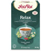 YogiTea Luomu Relax -teepakkaus; kuvituksena teekuppi sekä kamomillan ja ruusunmarjojen kuvia; etiketissä teksti "Tranquil, relaxed, calm"; sisältää 17 teepussia, yhteensä 30,6 g; suorakulmainen, mattapintainen vihreä pakkaus tekstausvapaalla kirjasimella; pystyssä seisova pakkaus kuvattu yksiväristä taustaa vasten, ei ihmisiä tai käsiä näkyvissä.
