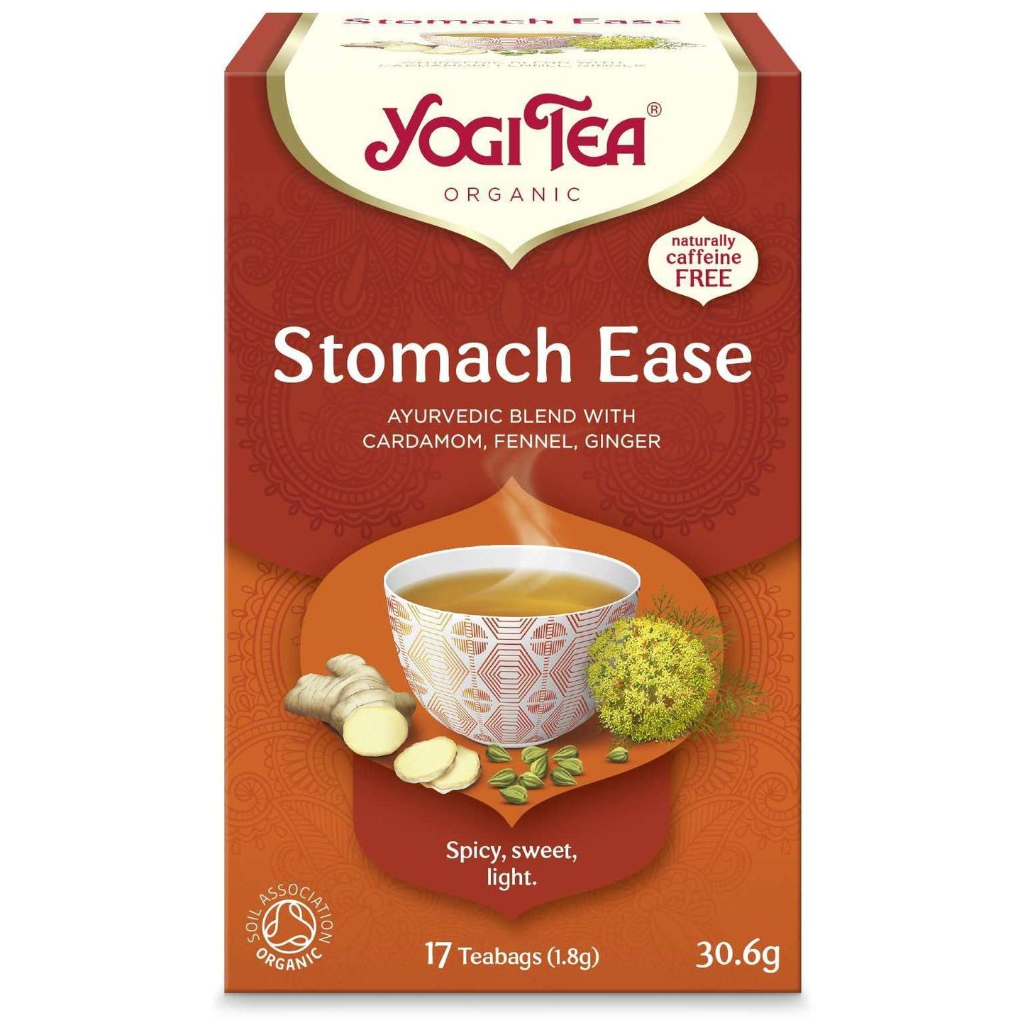 YogiTea Luomu Stomach Ease -teepakkaus, suorakaiteen muotoinen, mattapintainen, oranssi-ruskea; teekuppi pakkauksen vieressä, tuoretta inkivääriä, kardemumman siemenkotia ja fenkolinsiemeniä esillä; ayurvedinen sekoitus, kofeiiniton, 17 pussia (30,6 g)